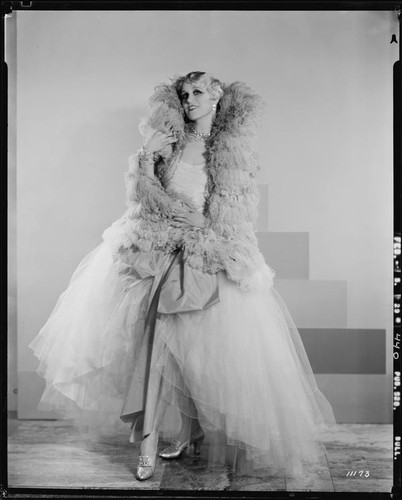 Peggy Hamilton modeling an Adrian tulle evening gown, 1929