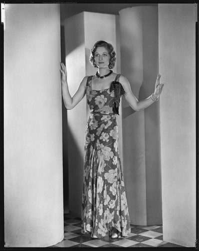 Actress Natalie Kingston modeling an evening gown from a Walter Switzer shop, 1930