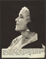 Peggy Hamilton modeling a velvet hat and a long dress of chiffon velvet and Alençon lace, 1930