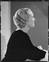 Peggy Hamilton modeling an Adrian gown and a Weaver Jackson hairstyle, 1933