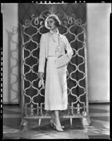 Actress Loretta Young modeling a white ensemble from the Walter Switzer Fashion Salon, 1932