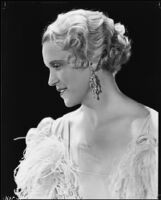 Peggy Hamilton modeling a hairstyle and evening gown, circa 1933