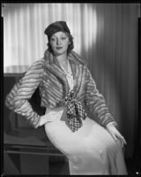 Actress Kathleen Burke modeling fur jacket from Beckman's, 1933