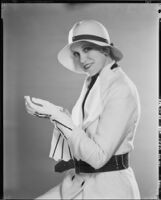 Peggy Hamilton modeling a Beaudine Hat with a sports ensemble in white angora wool, 1931