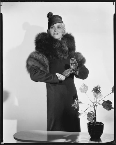 Peggy Hamilton modeling a coat, fur stole and hat, 1933