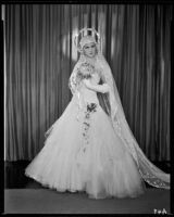 Peggy Hamilton modeling an Earl Luck wedding dress, 1931