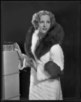 Actress Juliette Compton modeling an ermine coat from Beckman's, 1932