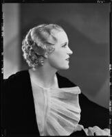 Peggy Hamilton modeling an Adrian gown and a Weaver Jackson hairstyle, 1933