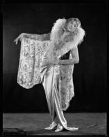 Peggy Hamilton modeling a Kathleen Kay gown of form-fitting velvet with pendant sleeves, 1927