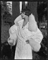 Actress (?) modeling an ermine (?) coat, circa 1930-1931