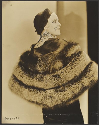 Peggy Hamilton modeling a fur stole and hat, 1931