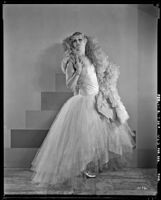 Peggy Hamilton modeling an Adrian tulle evening gown, 1929