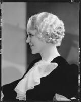 Peggy Hamilton modeling an Adrian gown and a Weaver Jackson hairstyle, 1933