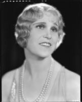 Peggy Hamilton modeling a hairstyle and dance frock decorated with bugle beads and rhinestones, 1930