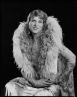 Peggy Hamilton modeling a Kathleen Kay gown of form-fitting velvet with pendant sleeves, 1927