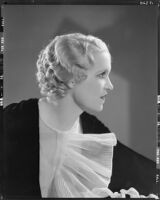 Peggy Hamilton modeling an Adrian gown and a Weaver Jackson hairstyle, 1933