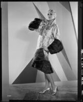 Peggy Hamilton modeling an Adrian evening wrap of brocade and mink, 1929