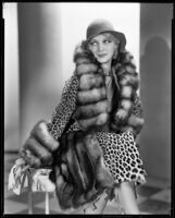 Actress Noel Francis modeling a fur coat, circa 1931-1933 — Calisphere