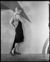 Peggy Hamilton modeling an Adrian cocktail dress (probably by Adrian), 1929