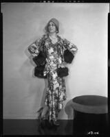 Peggy Hamilton modeling suit in a floral patterned silk with fur trim, circa 1930