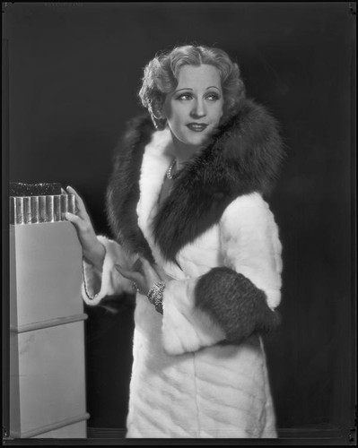 Actress Juliette Compton modeling an ermine coat from Beckman's, 1932