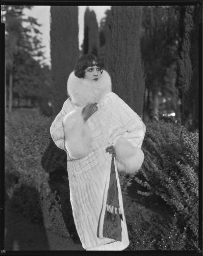 Actress (?) modeling an ermine (?) coat, circa 1930-1931