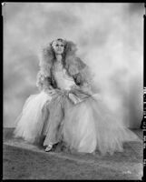 Peggy Hamilton modeling an Adrian tulle evening gown, 1929