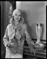 Actress (?) modeling a fur jacket, circa 1931-1933