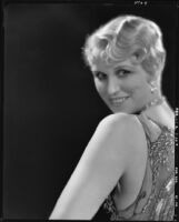 Peggy Hamilton modeling an Adrian cocktail dress (probably by Adrian), 1929