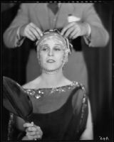 Peggy Hamilton modeling a headband with braided pearls, 1931