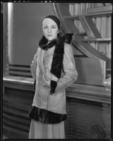 Actress (?) modeling a fur coat, circa 1931-1933