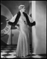 Peggy Hamilton modeling a long lace dress from Jean Swartz's Fashion Salons, 1930