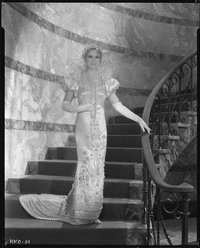 Peggy Hamilton modeling a Max Rée gown as "Queen Olympia," 1931