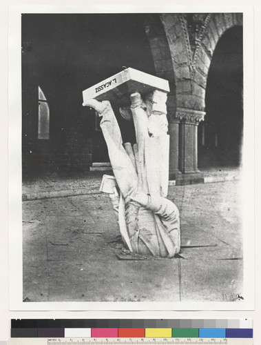 Statue of Agassiz Statues [thrown from its niche above arches, head buried in pavement] Stanford University