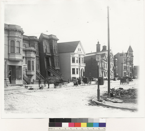 [Tilted houses with horses & carriages in front. Howard St.]