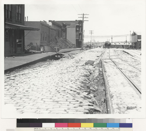 Ninth and Brannan Streets, San Francisco. (2 views of apparently same street, damage to rail lines and cobbled street.)