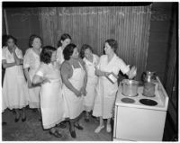Women listening to an instructor at the School for Household Employees, Los Angeles