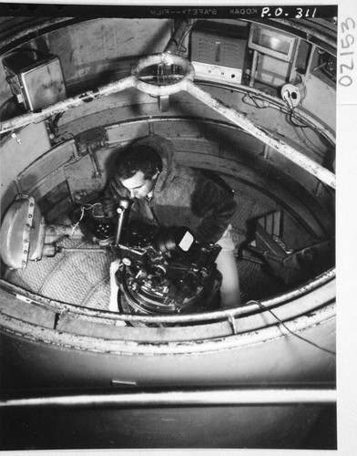 Halton C. Arp at the 200-inch telescope prime-focus spectrograph in a cage, Palomar Observatory