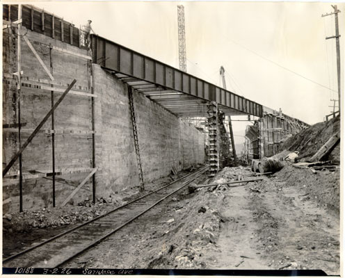 [Railroad tracks pass under San Jose Avenue bridge during construction]