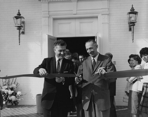 C. M. Featherly at a ribbon cutting event