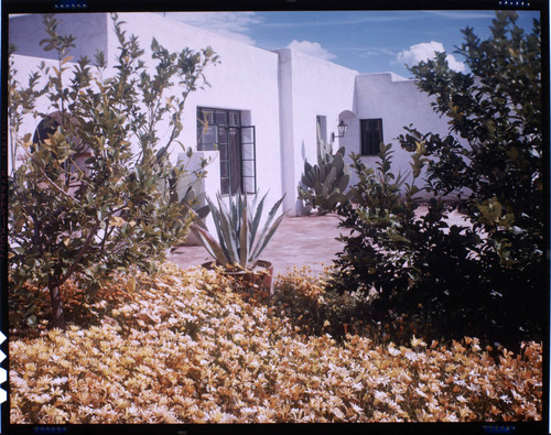 [Unidentified residential exteriors and landscaping]. Spanish-style, garden