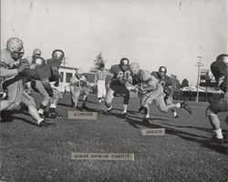 Run play during Petaluma Leghorn game against Eagle Rock Athletic Club