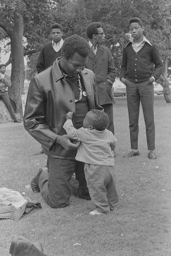 Black Panther and son, Free Huey Rally, De Fremery Park, Oakland, CA, #91 from A Photographic Essay on The Black Panthers