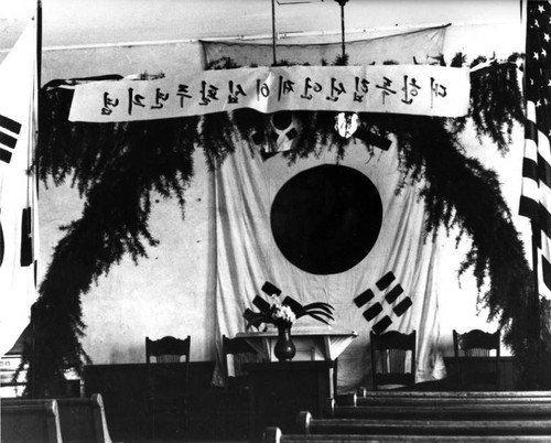 Interior of meeting hall decorated with Korean flag