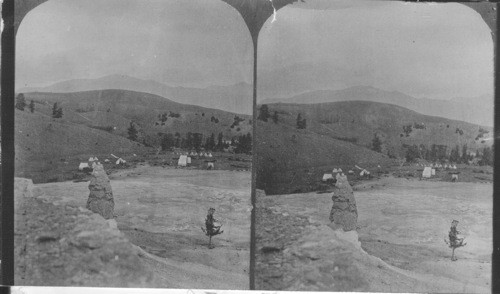 View at the Hot Springs (Mammoth), Wyoming, shows Liberty Cap with no buildings, only tents on flat N.E. where buildings are not. Historical - No copyright. Div. of prints - Serial #46811