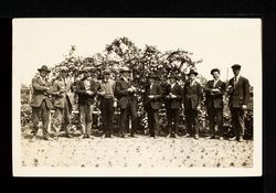Luther Burbank and Charles Hampton in front of rose trellis in Santa Rosa