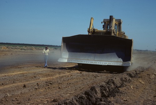 Caterpillar pulling a 5 ft soil chisler, near Patterson