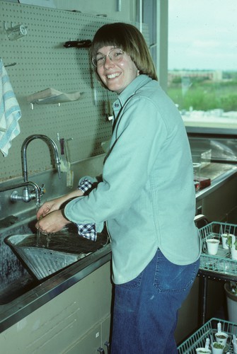 Kay Moon, Staff research assistant, in 5th floor lab, Hutchison Hall