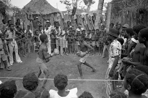 Two young boys boxing in a boxing ring, San Basilio de Palenque, 1977