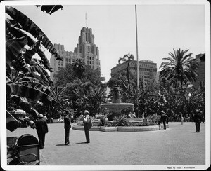 A fountain in Pershing Square in downtown Los Angeles with a sign prohibiting public speaking, debating, and blocking walks